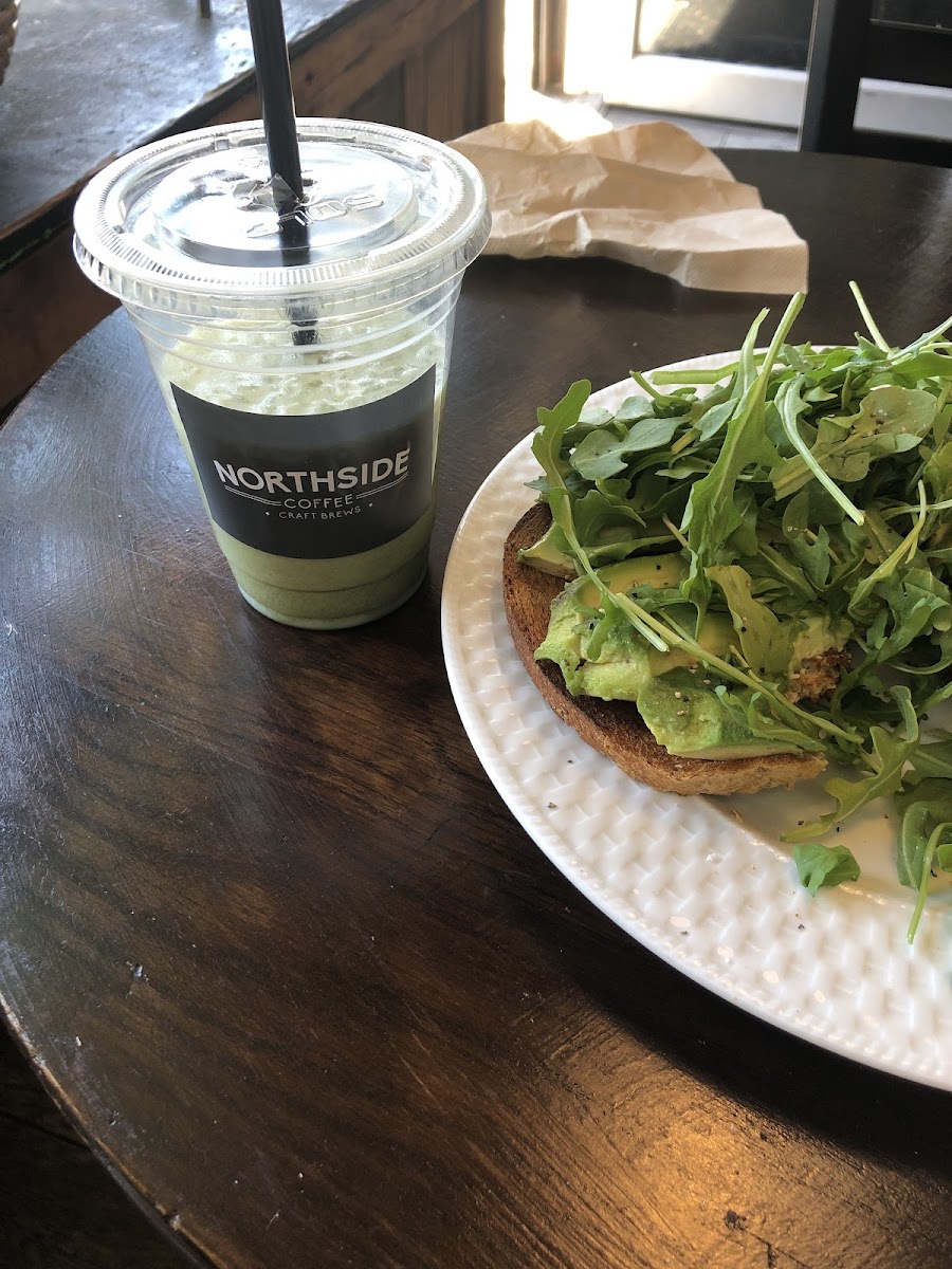Inside Northside Coffee — matcha and avocado toast by the window